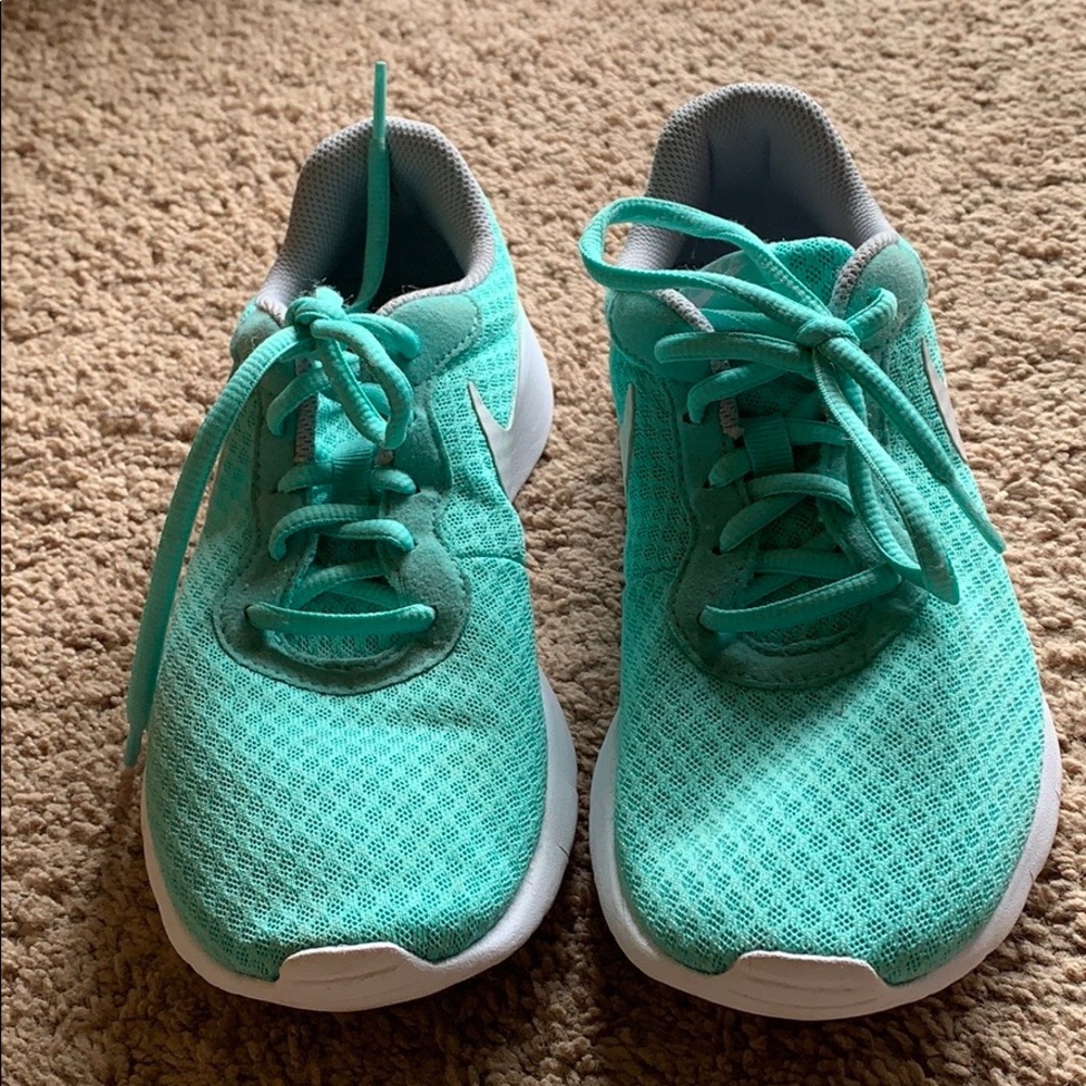 Teal Nike running shoes